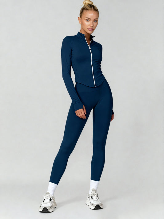 Woman wearing a blue athletic outfit on a gray background