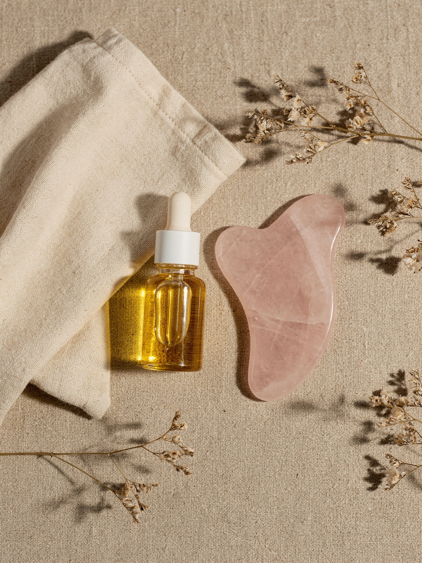 Rose Quartz Gua Sha Facial Tool self-care flat lay