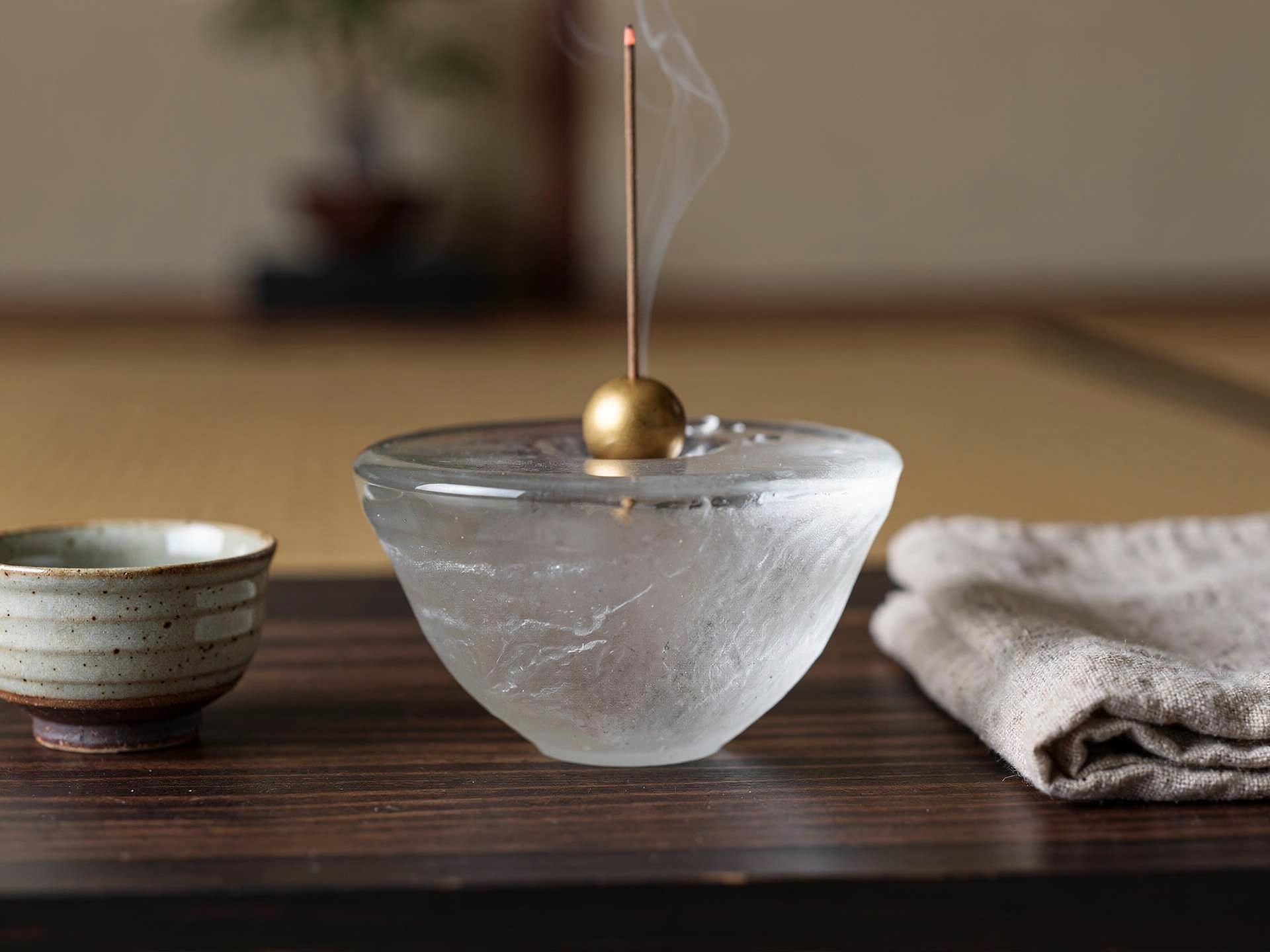 Glass incense stand styled in a Japanese tea ceremony setting